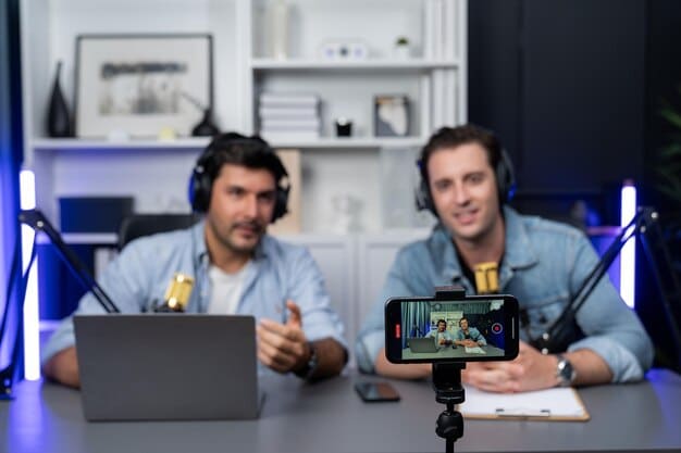 Two Kings League streamers appearing side-by-side on a split-screen live broadcast. One streamer is leaning in and laughing at something the other is saying, conveying a sense of camaraderie and collaboration.