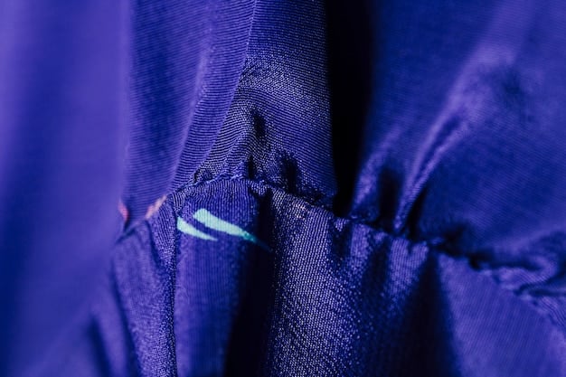 A close-up shot of a Kings League jersey, highlighting the quality of the fabric, stitching, and the vibrant colors of the team's logo. The jersey is displayed in a way that emphasizes its premium feel and design details.